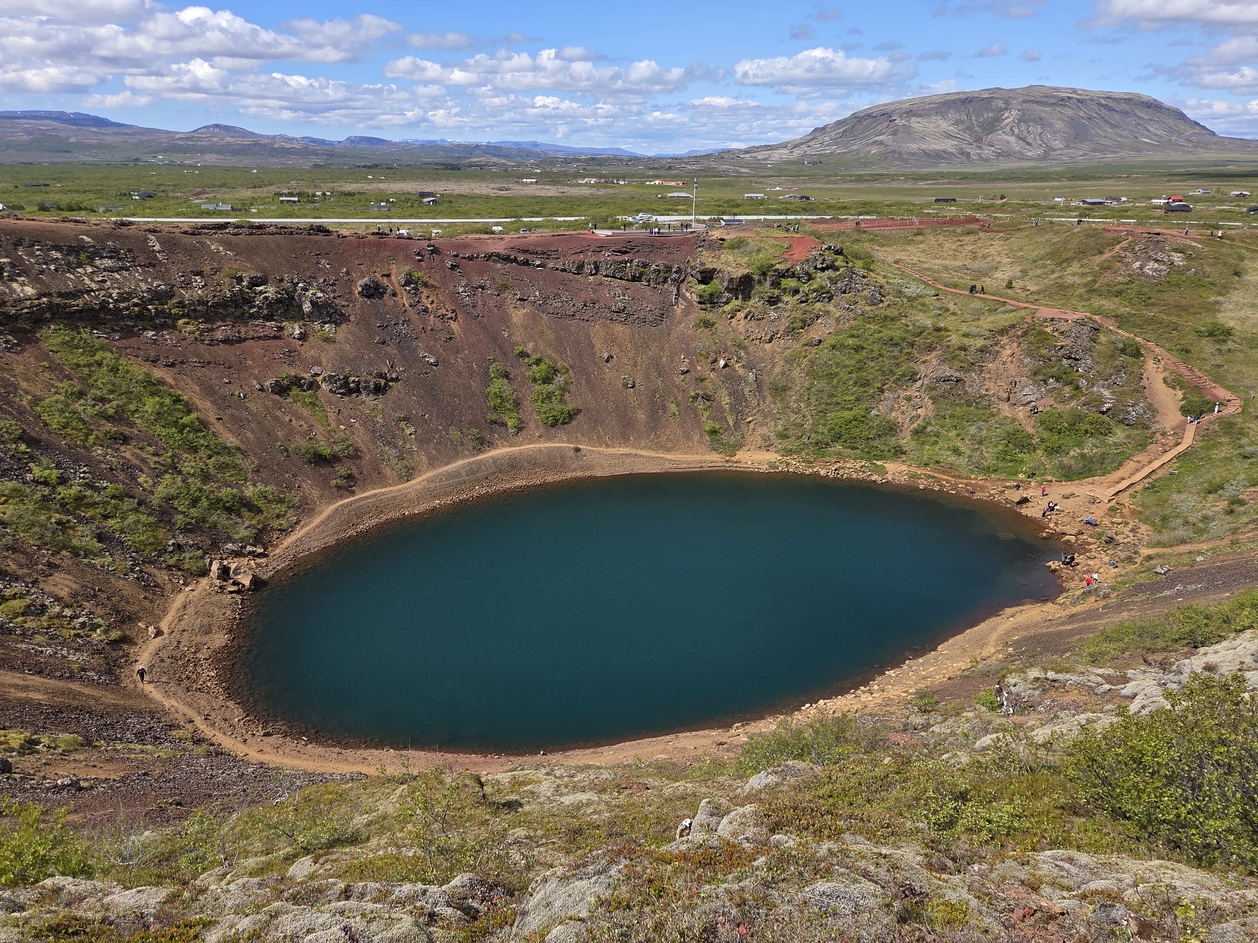 Panoramic view of Kerið volcanic crater lake with surrounding Icelandic landscape